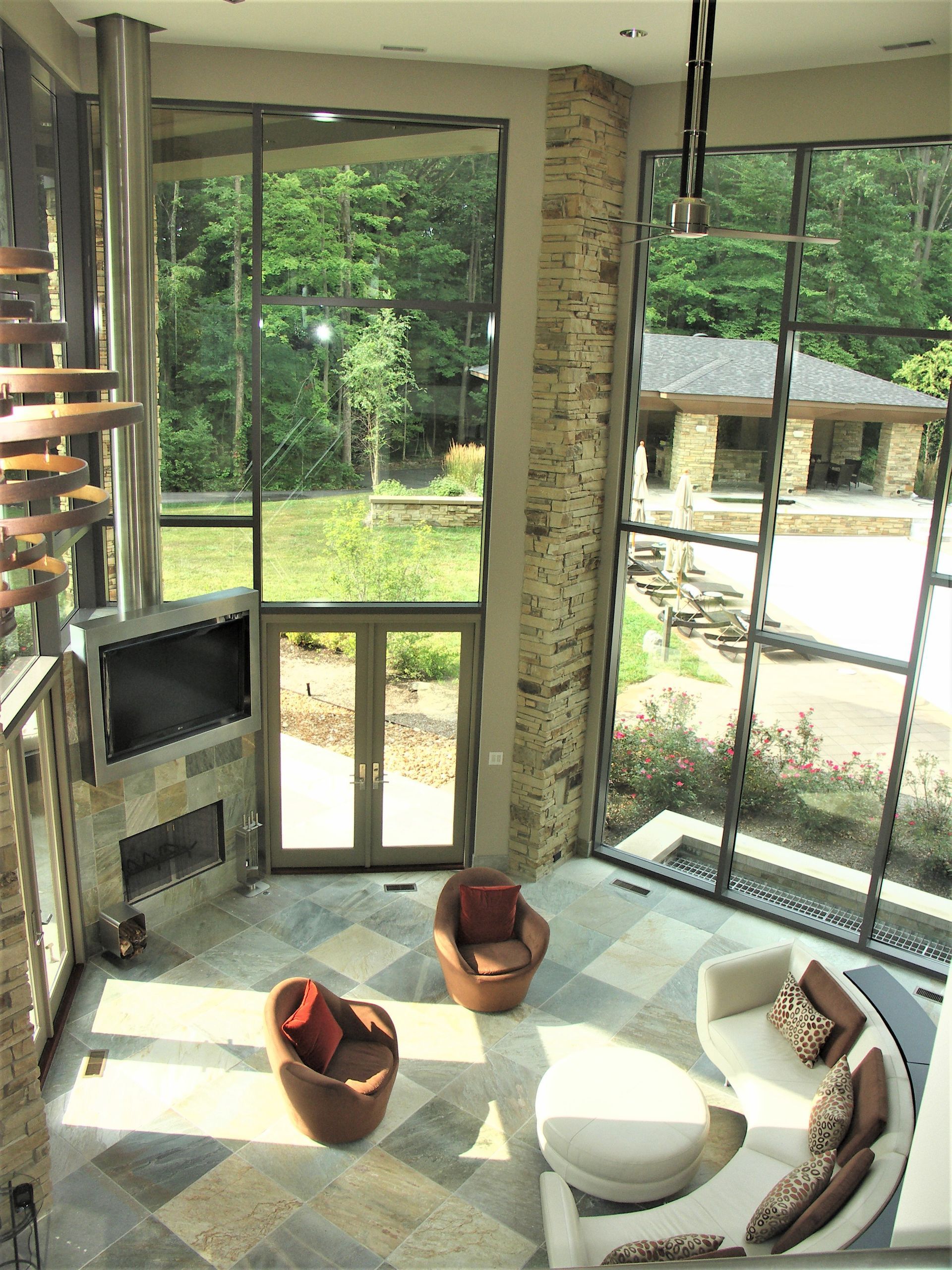 A Living Room With A Couch And Chairs And A Fireplace - Carmel, IN - Goldberg Design Group