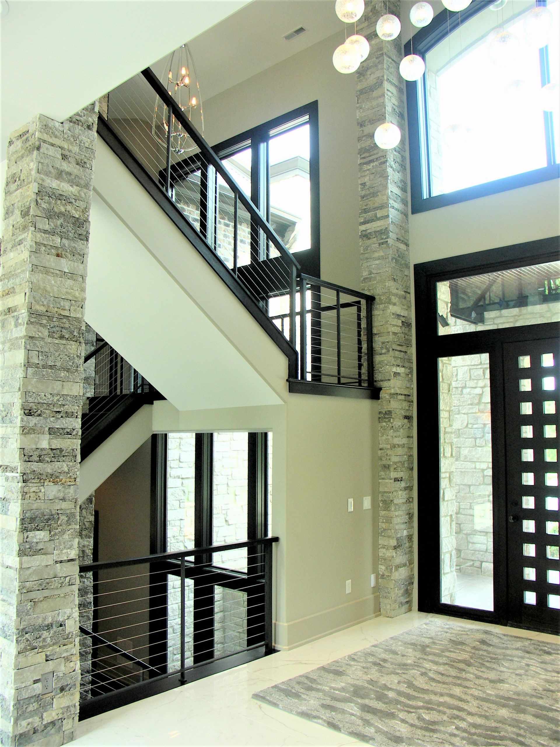 A Staircase In A House With Lots Of Windows - Carmel, IN - Goldberg Design Group