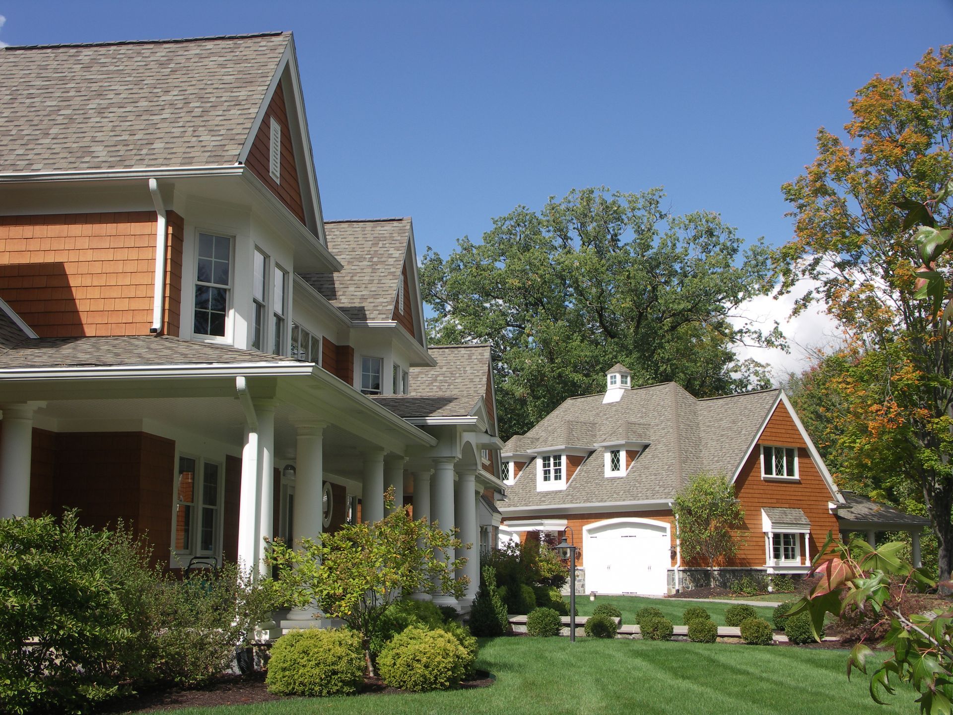 A Row Of Houses With A Lush Green Lawn - Carmel, IN - Goldberg Design Group
