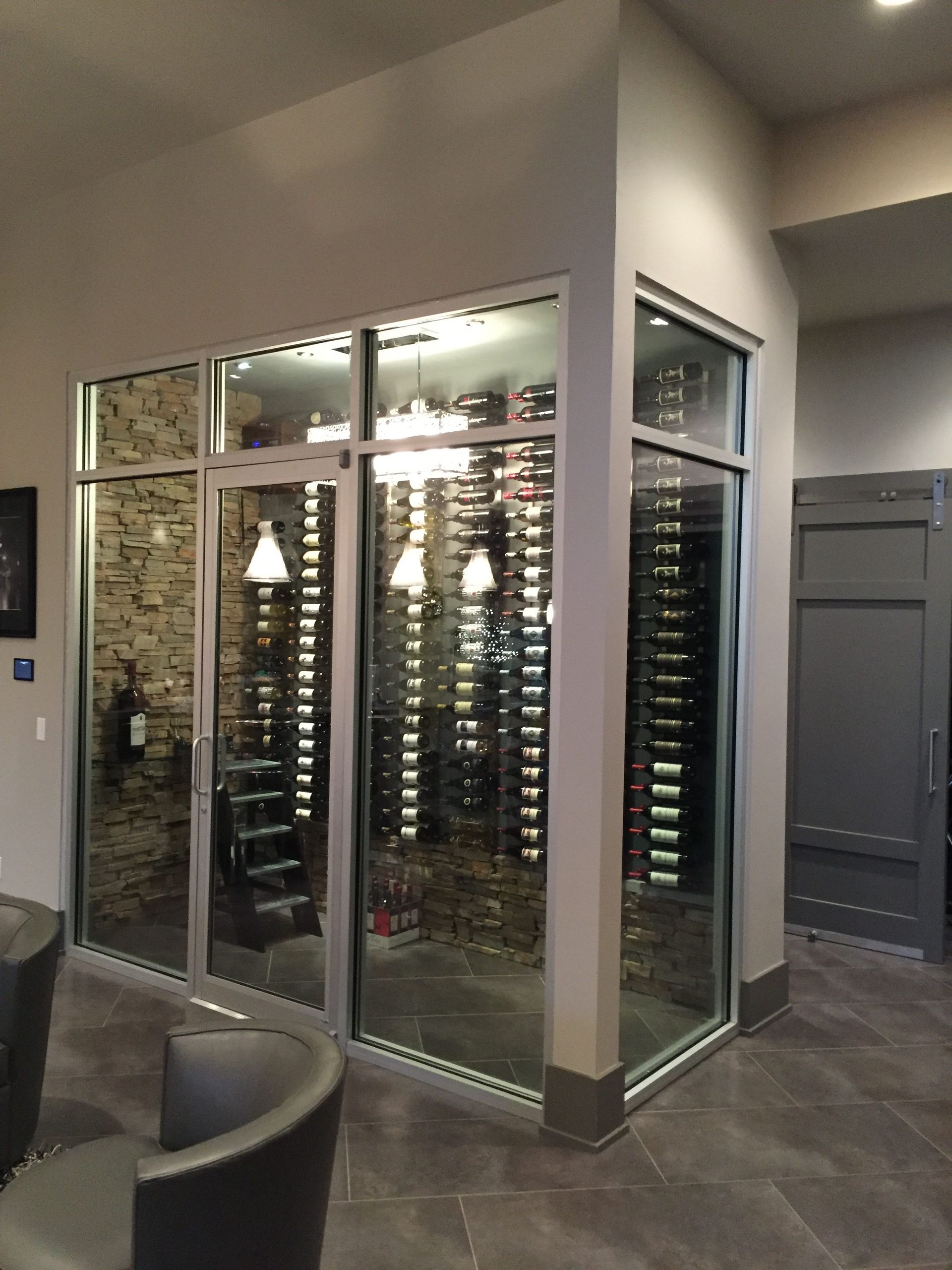 A Wine Cellar With A Lot Of Bottles In It - Carmel, IN - Goldberg Design Group