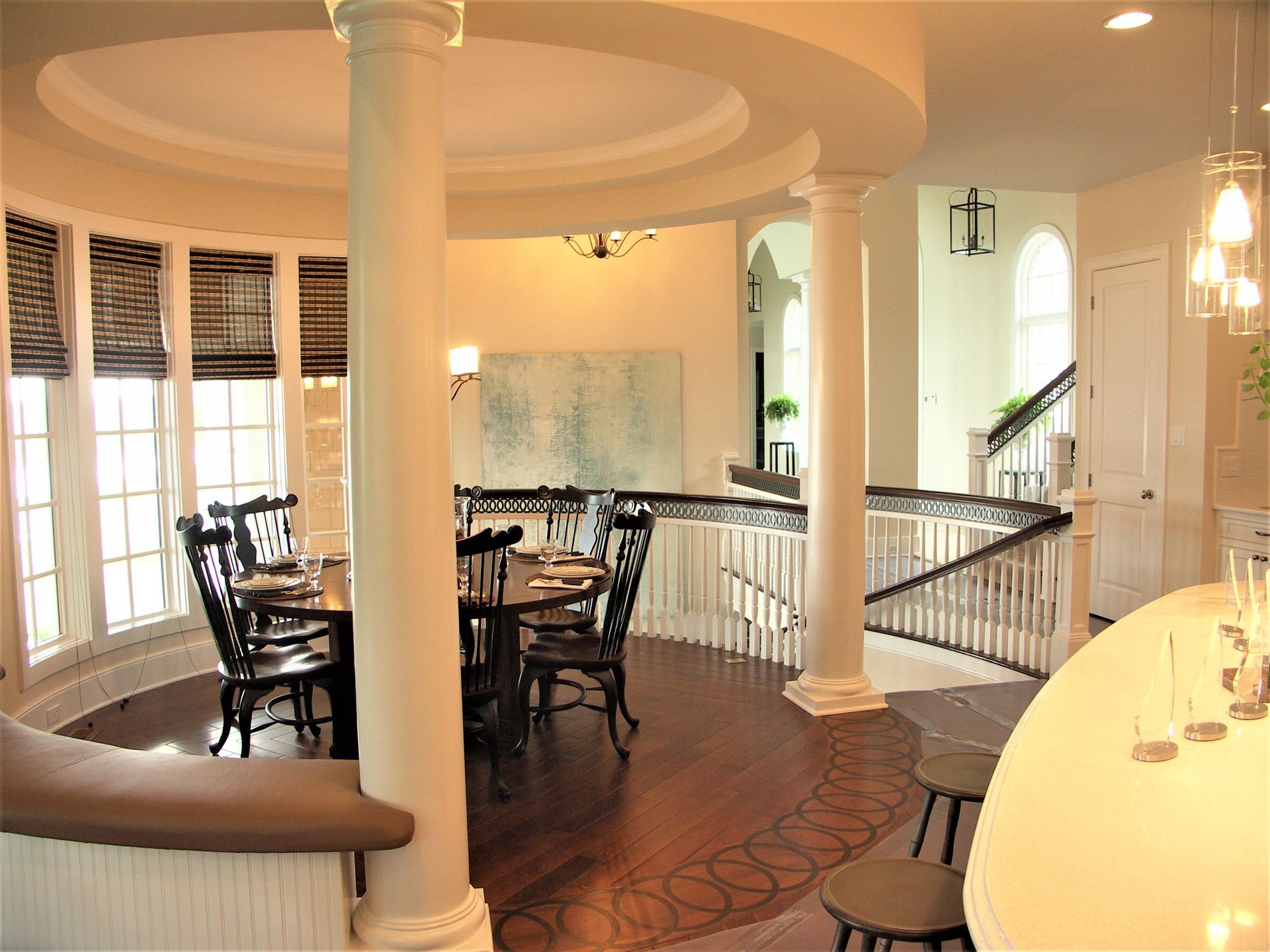 A Dining Room With A Round Table - Carmel, IN - Goldberg Design Group