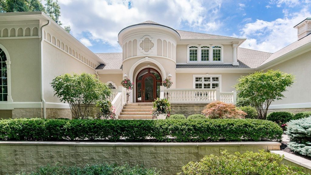 A Large White House Surrounded By Bushes And Trees - Carmel, IN - Goldberg Design Group