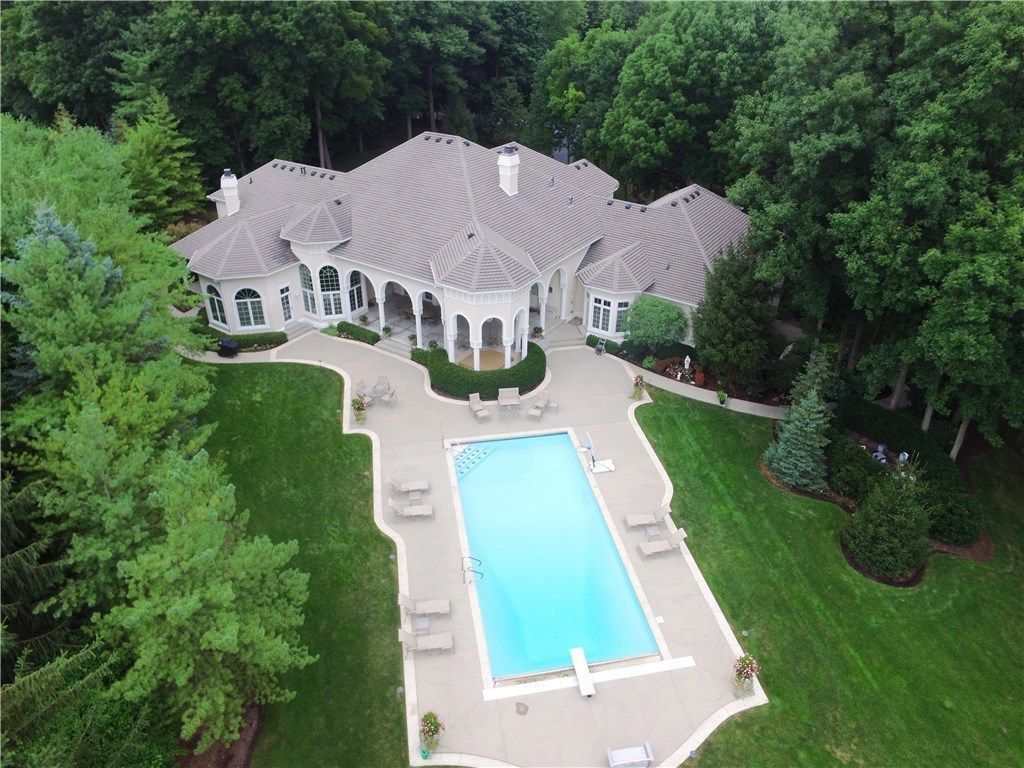 An Aerial View Of A Large House With A Large Swimming Pool - Carmel, IN - Goldberg Design Group