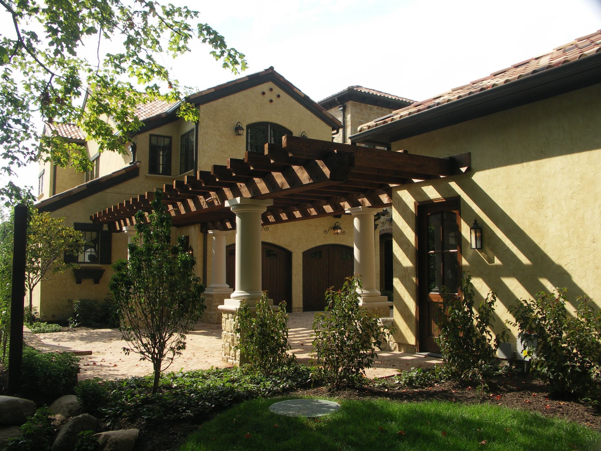 A Large House With A Pergola On Top Of It - Carmel, IN - Goldberg Design Group