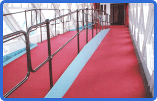 red carpet tiles along a public walkway