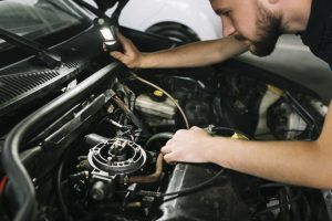 Man working under hood | Eagle Transmission & Auto Repair - Austin-North