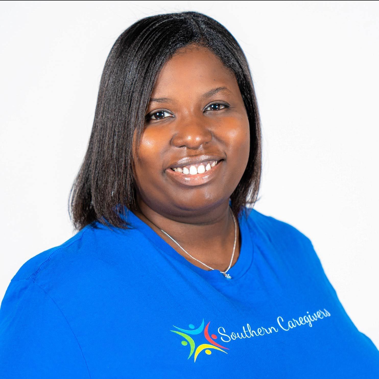 A woman wearing a blue shirt that says southern caregivers