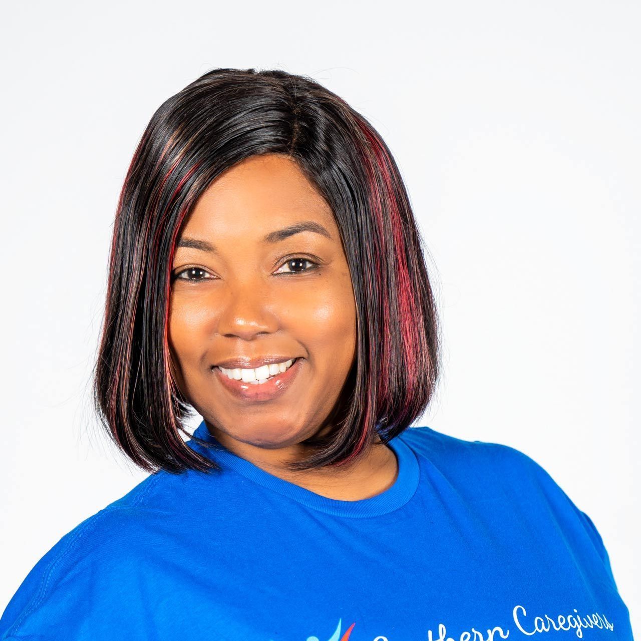 A woman wearing a blue shirt that says southern caregivers