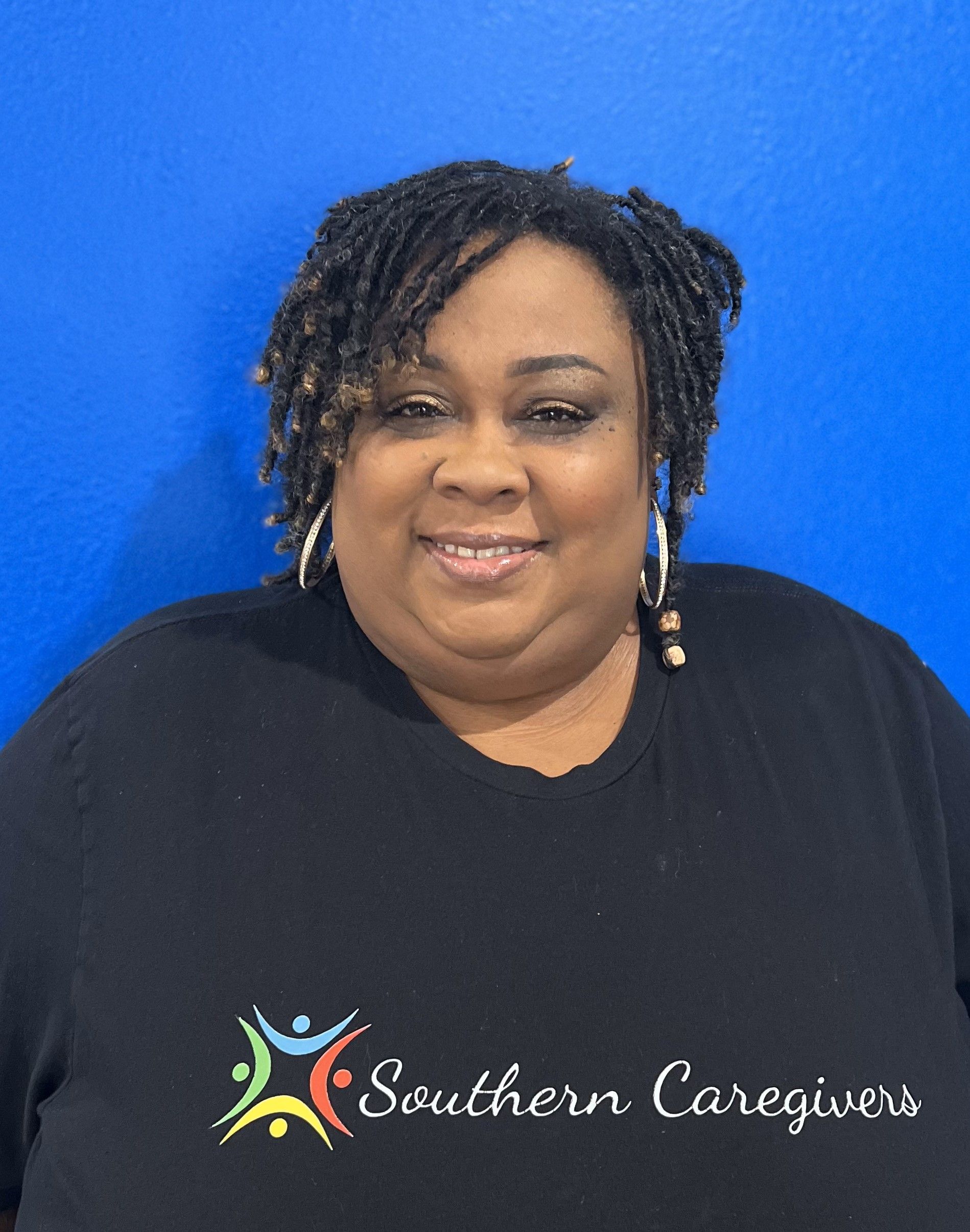 A woman wearing a black shirt that says southern caregivers