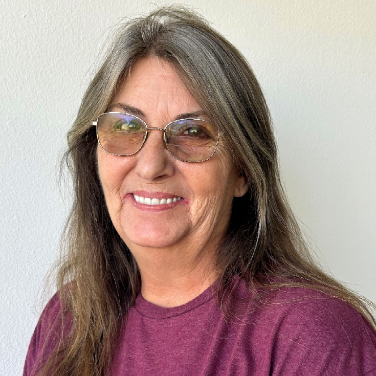 a professional headshot of Regina Wood
