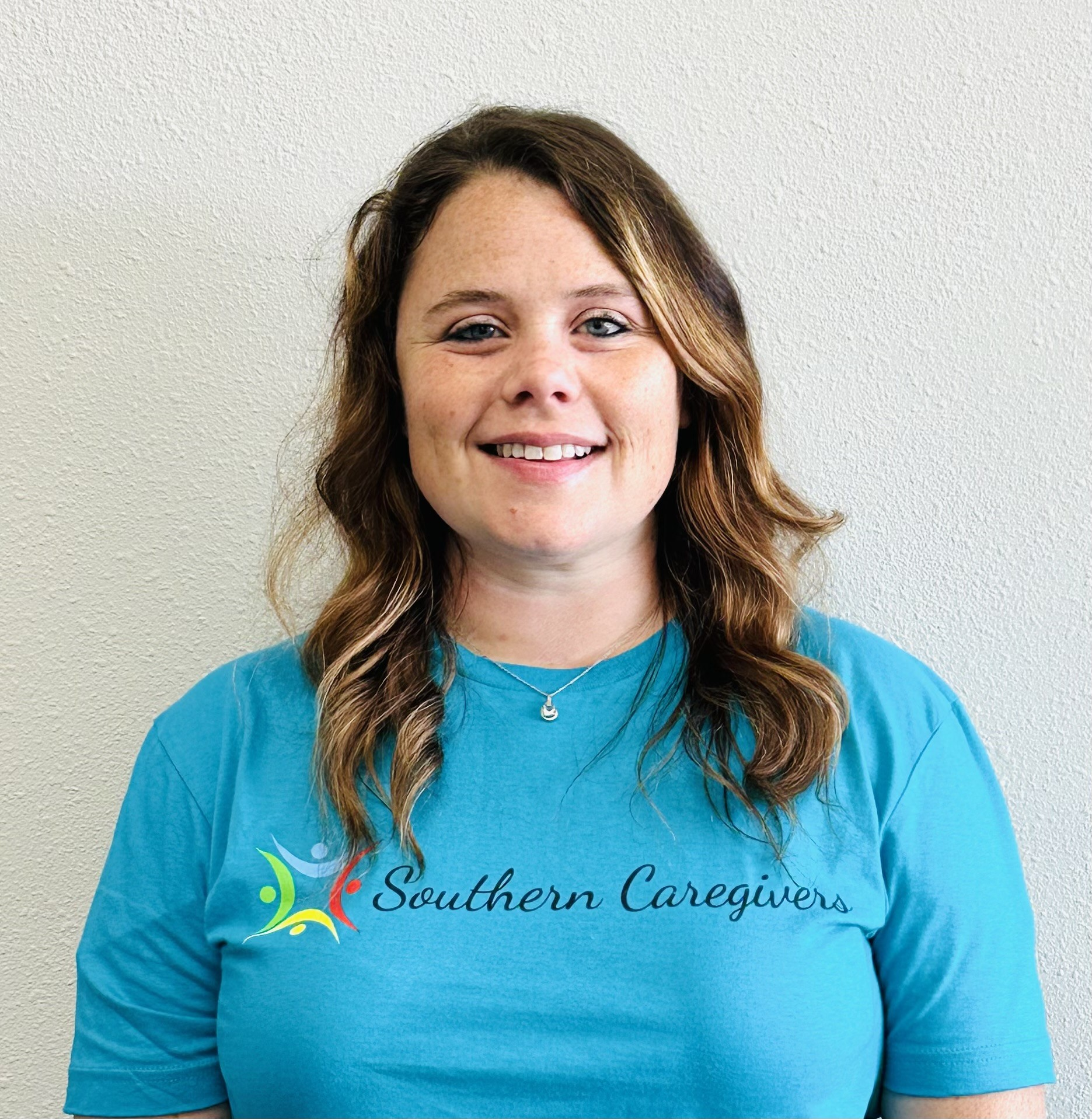 woman in blue southern caregivers tshirt