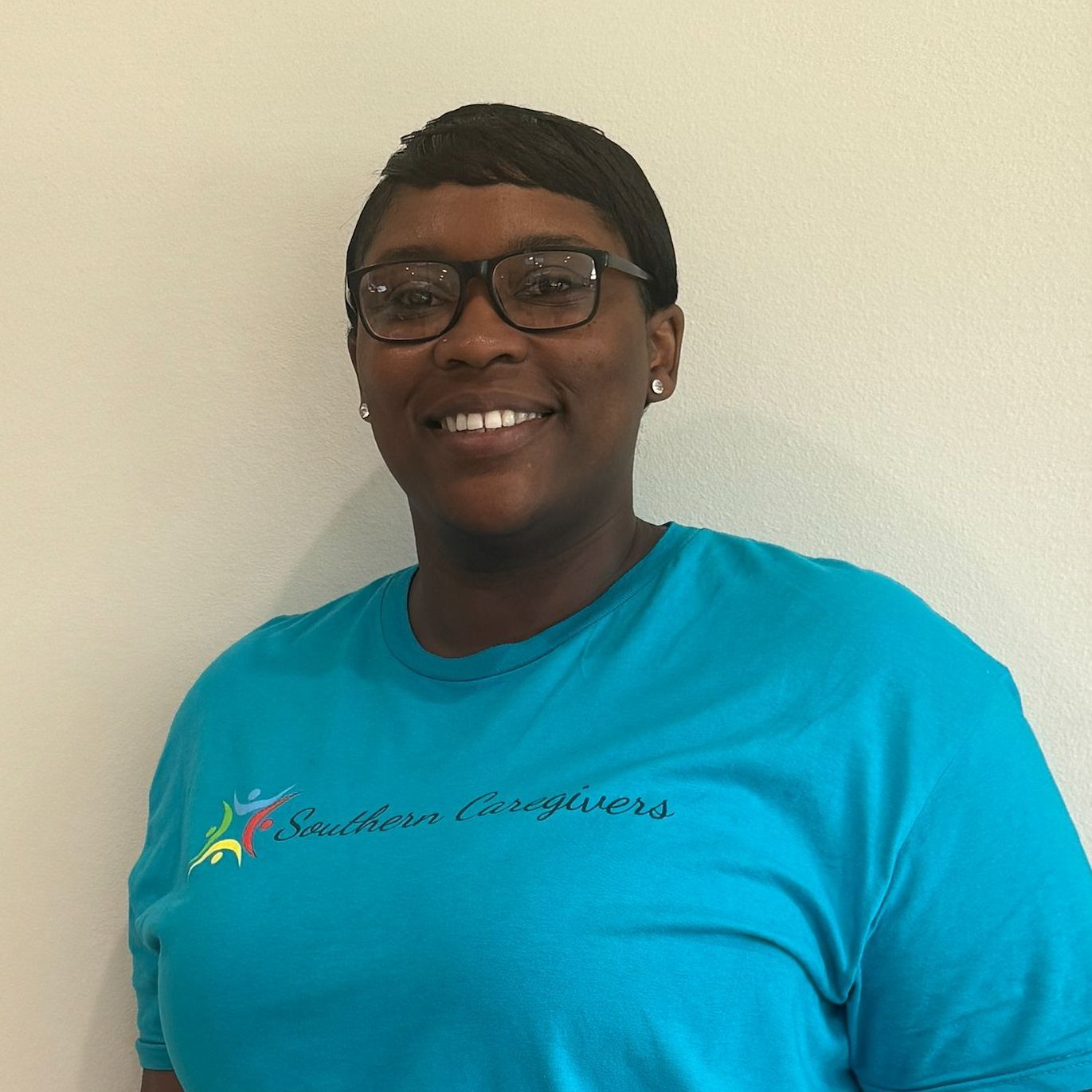 a professional headshot of T Holley wearing a southern caregivers t shirt