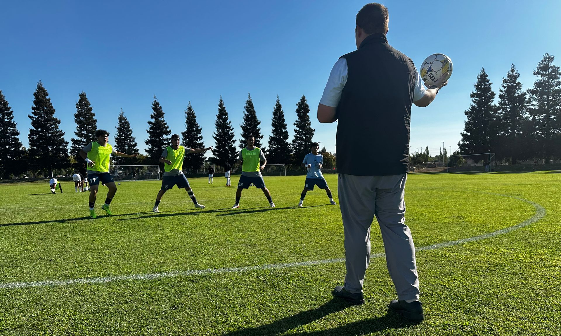 Joe Bouchelle doing a drill with a few of his players.