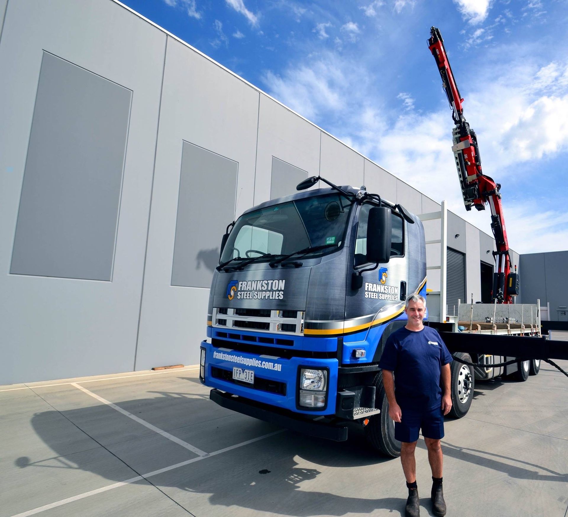 A man standing in front of a truck that says petra on it