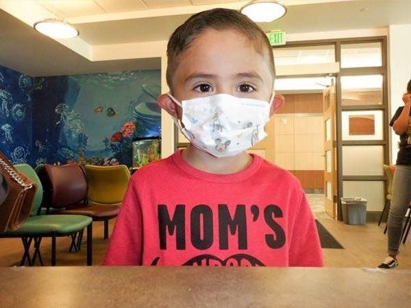 Child wearing a mask and a 