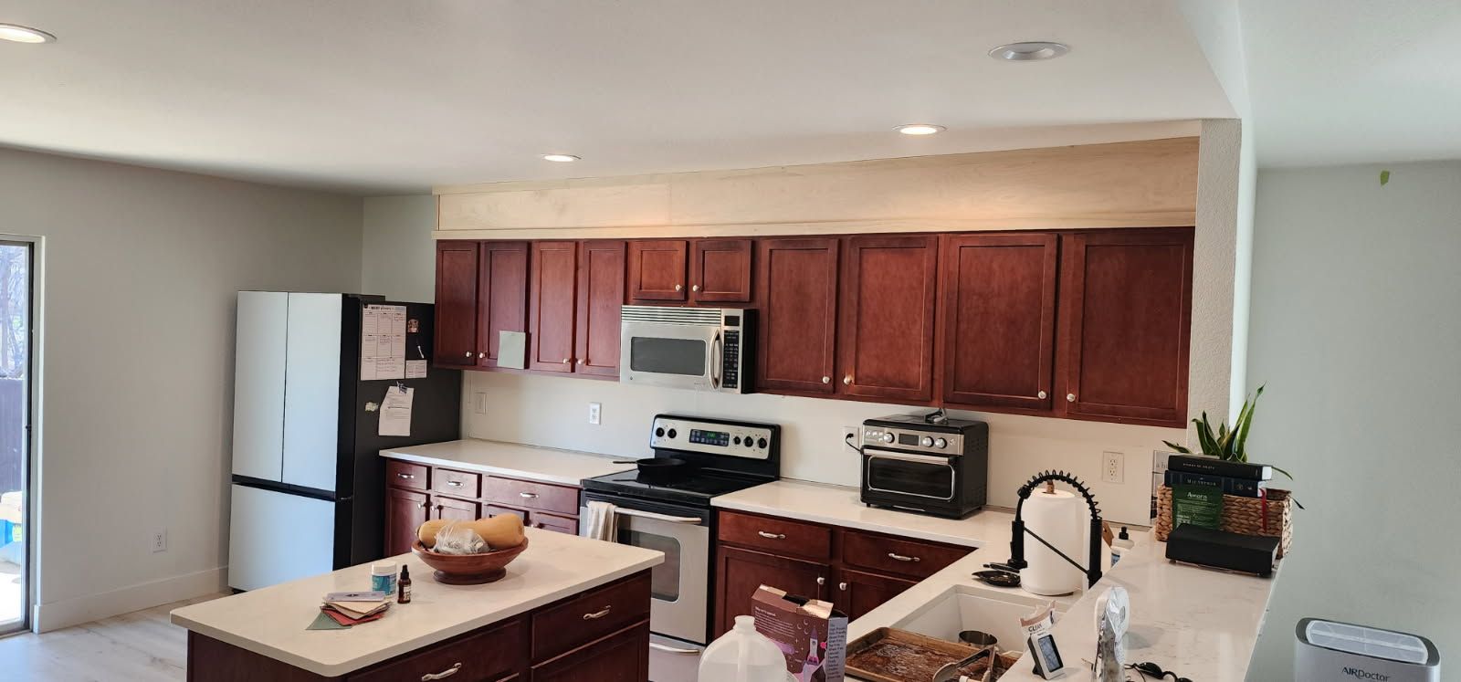 Filling the open space above upper cabinets. Refacing Shaker style project
