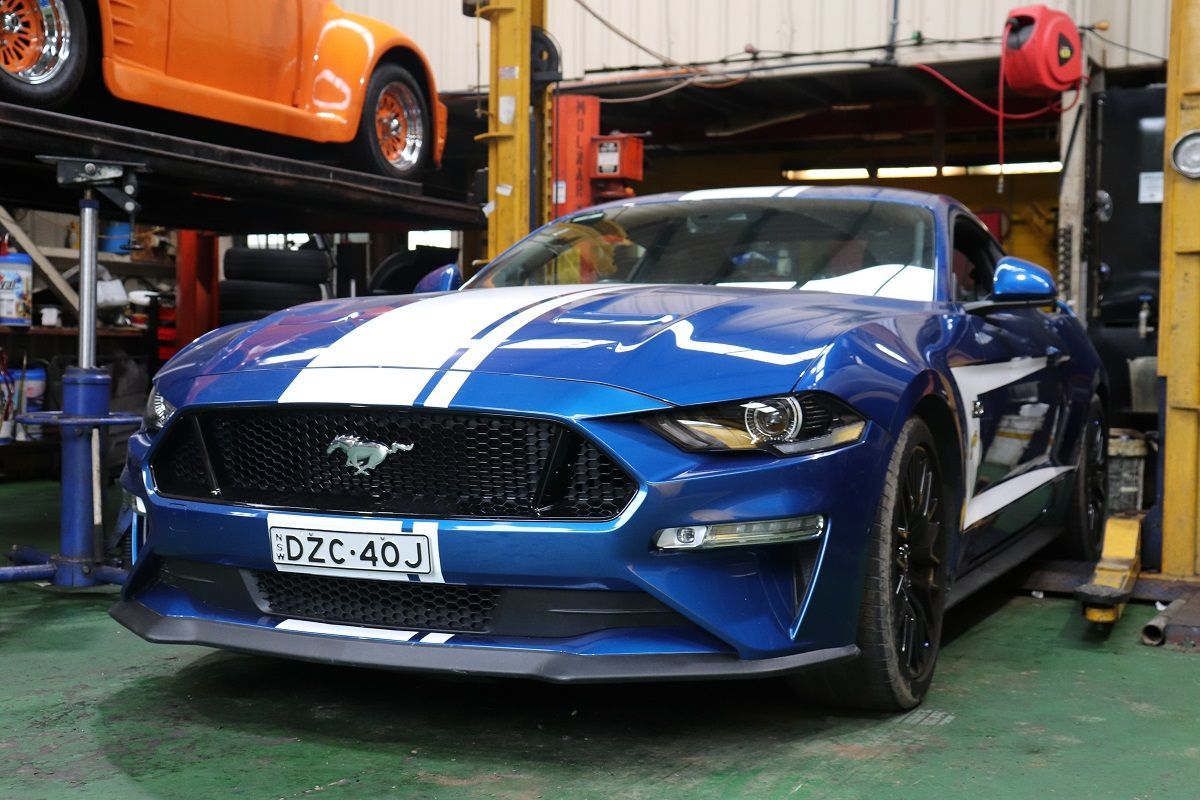 Blue Ford Mustang With White Racing Stripes Being Worked On — Ballina Car Centre in Ballina, NSW