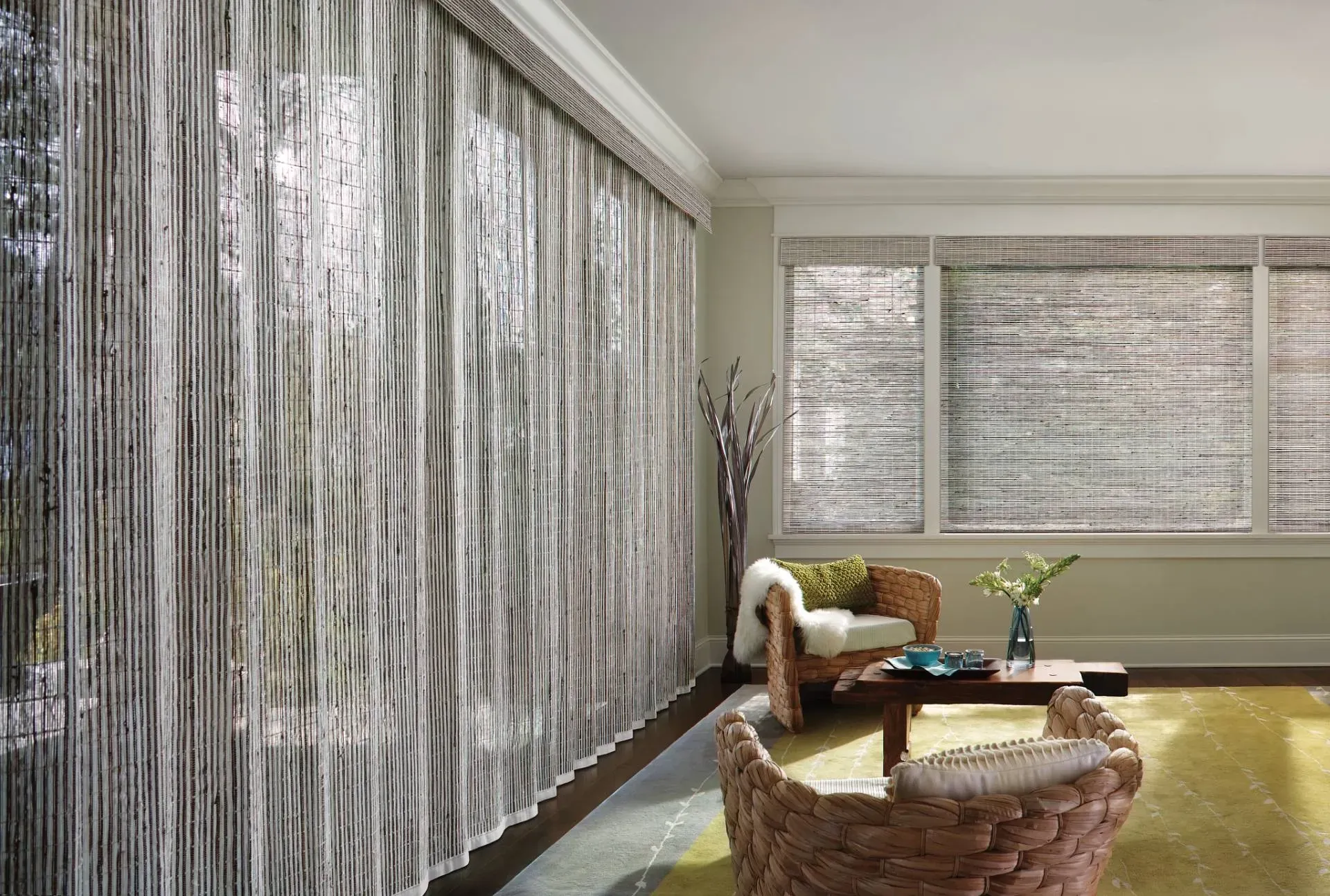Wooden blinds filtering sunlight in a room with patterned wallpaper and a decorative chair.