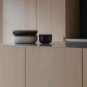 Three bowls are stacked on top of each other on a counter.
