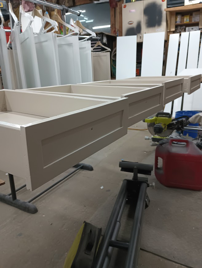 White painted cabinet boxes in a workshop.