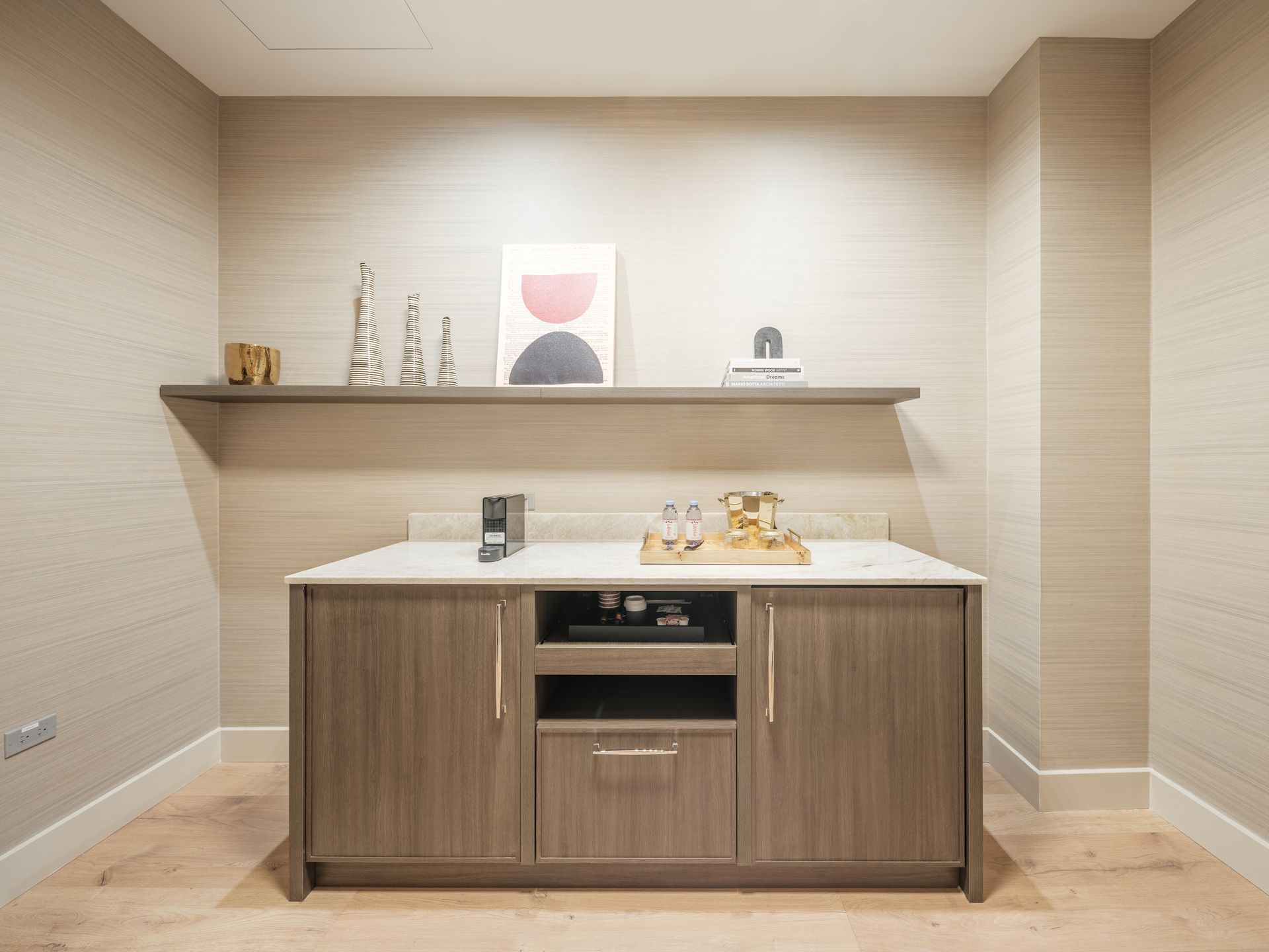 A small room with a wooden cabinet and a white counter top.