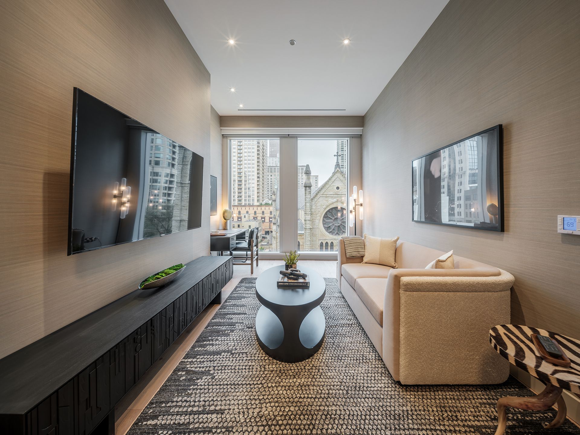 A living room with a couch and a flat screen tv
