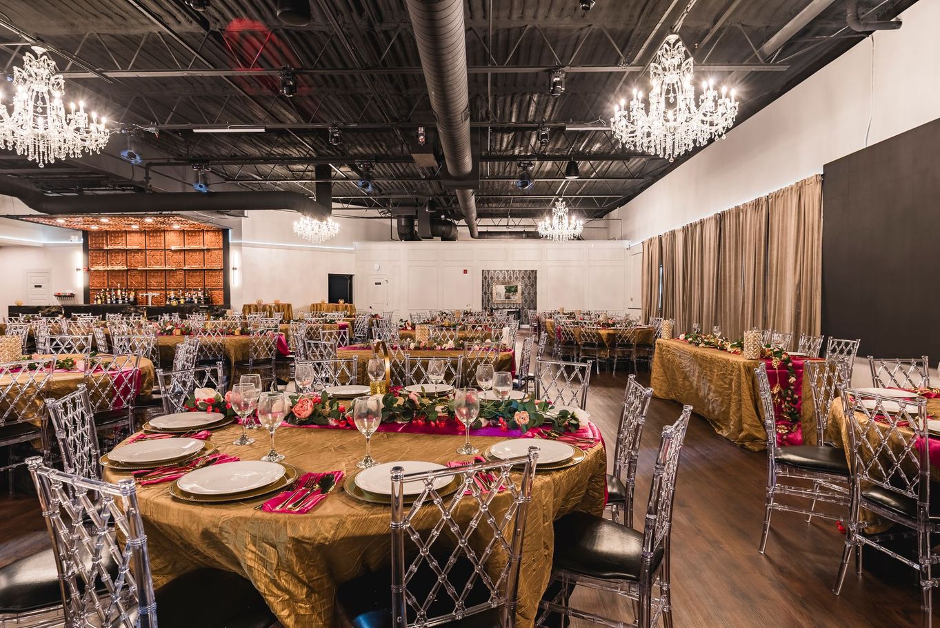 A buffet table laden with appetizers, featuring stacked black serving displays.