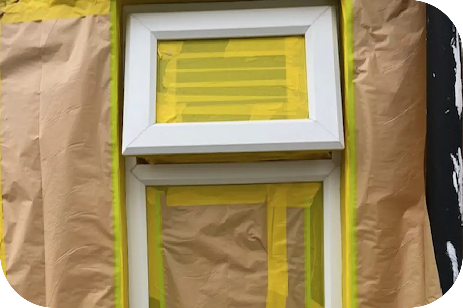 An attic with a pipe covered in aluminum foil