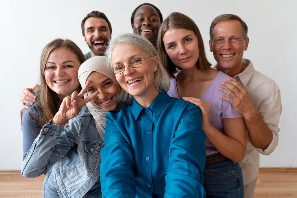 Diverse smiling group of people looking at camera