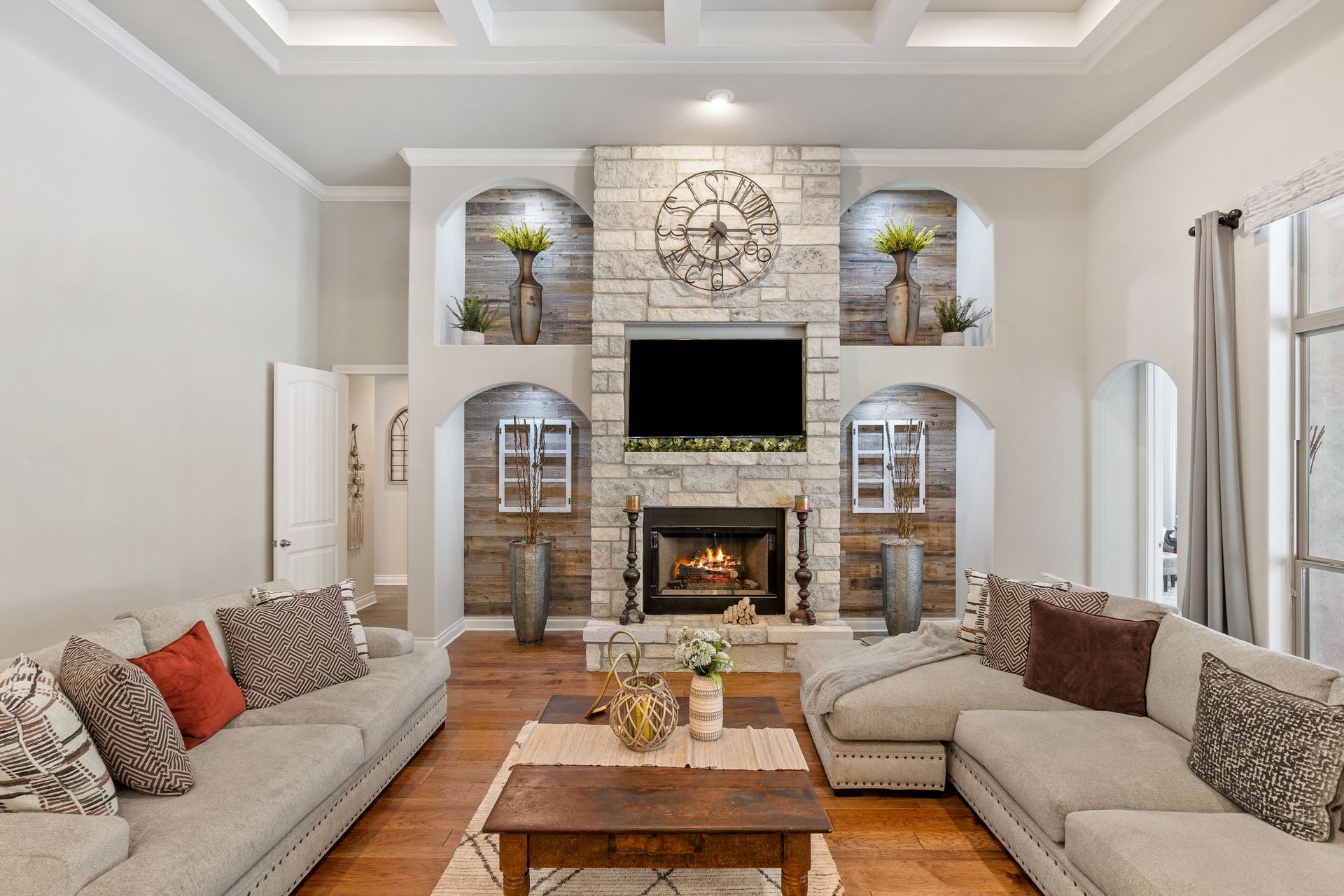 A living room with lots of furniture and a fireplace