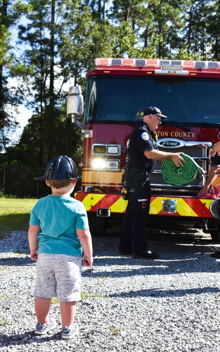 boy looking at firetruck