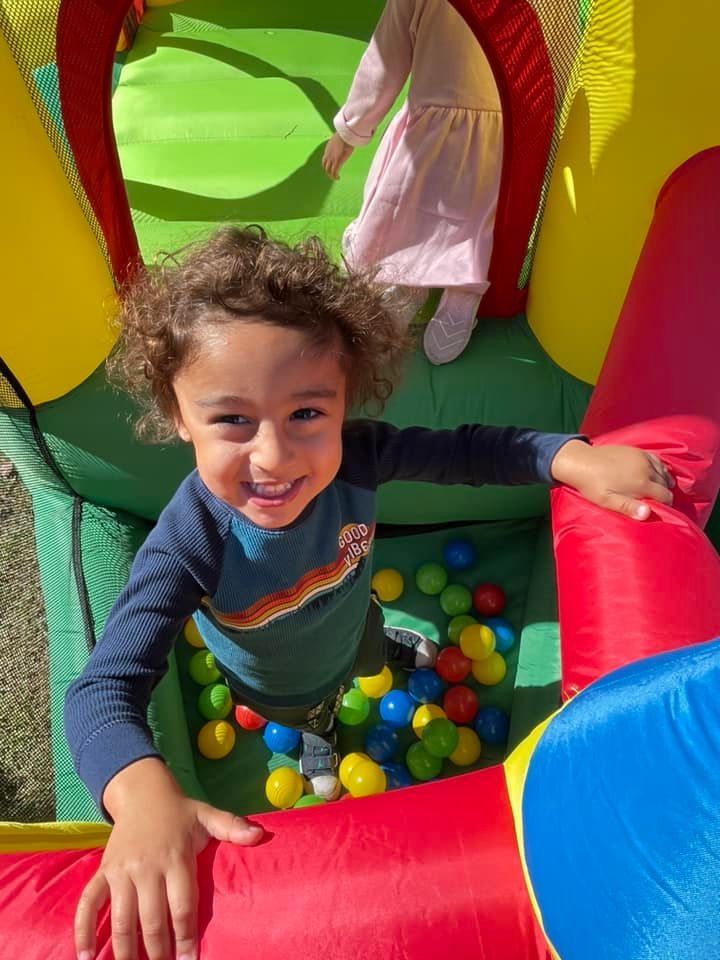 boy in bounce house