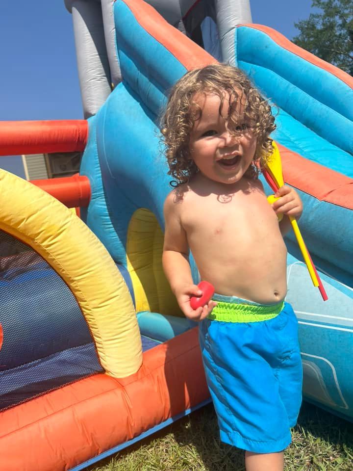 day care kid on slide