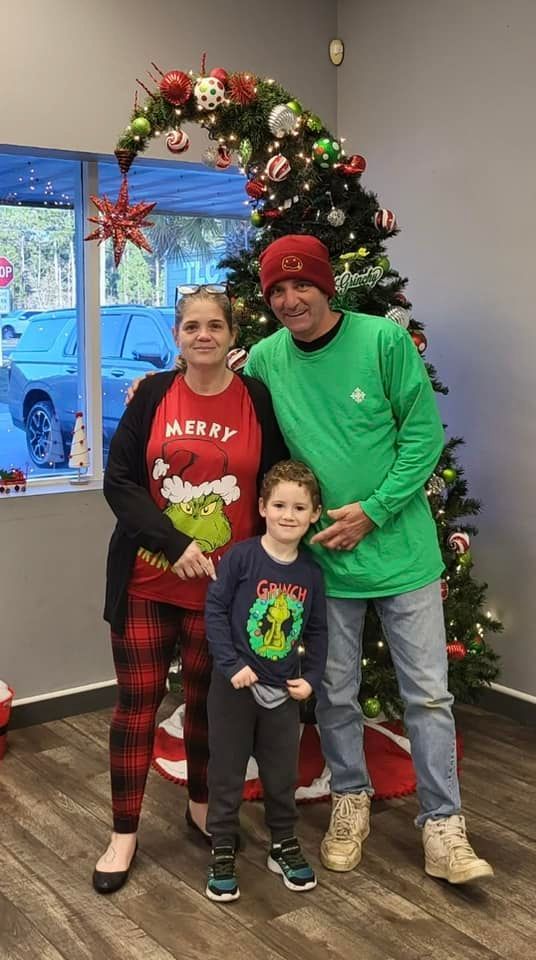 family with Christmas tree