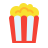 A classic red and white striped popcorn bucket filled with fluffy, yellow popcorn.