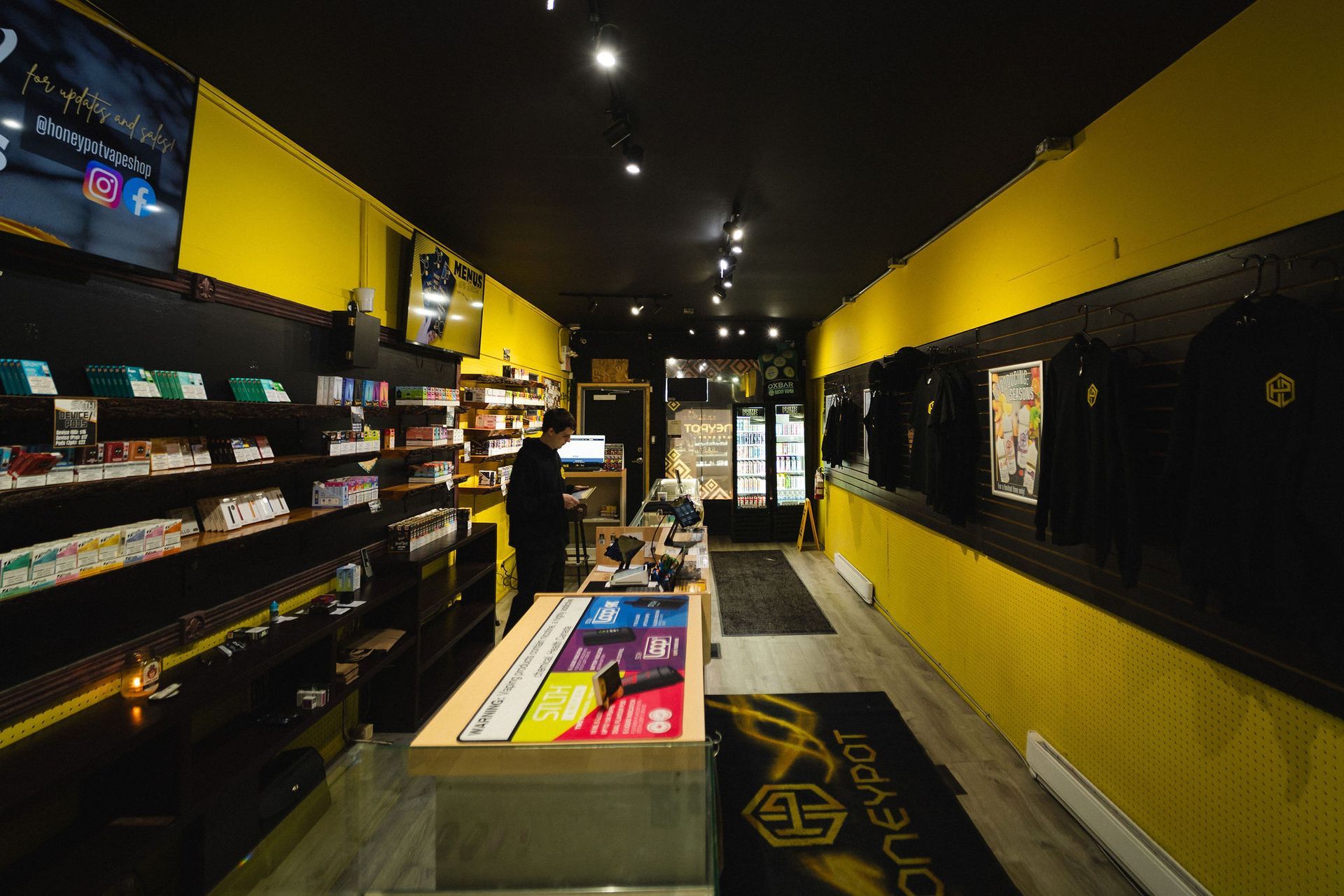 A man and a woman are standing next to each other in a room.