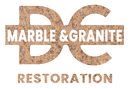 Pile of grey rocks with text "D C Marble and Granite Restoration" on a marble background.
