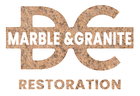 Pile of grey rocks with text "D C Marble and Granite Restoration" on a marble background.