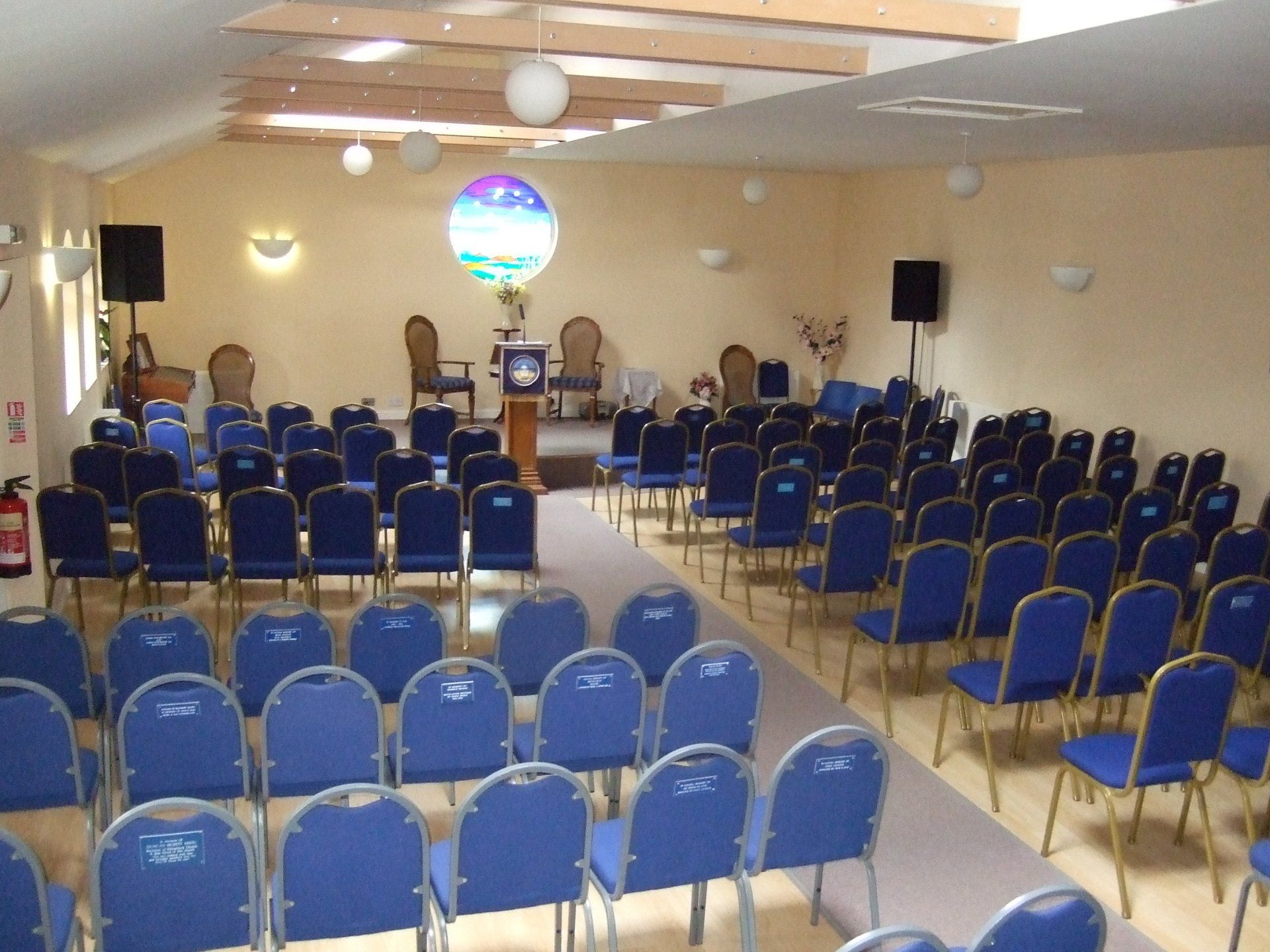 Aberdeen Spiritualist Centre, the hall with podium, stage, and rows of empty chairs
