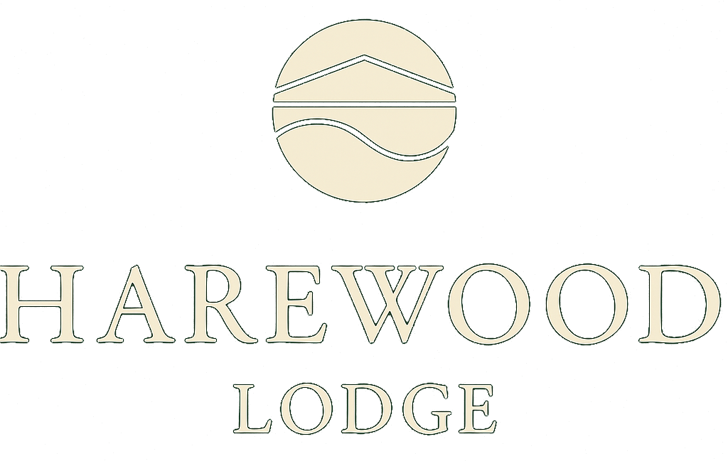 A logo for harewood lodge with a ball in the middle