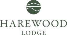 The logo for harewood lodge has a green circle with a house on it.