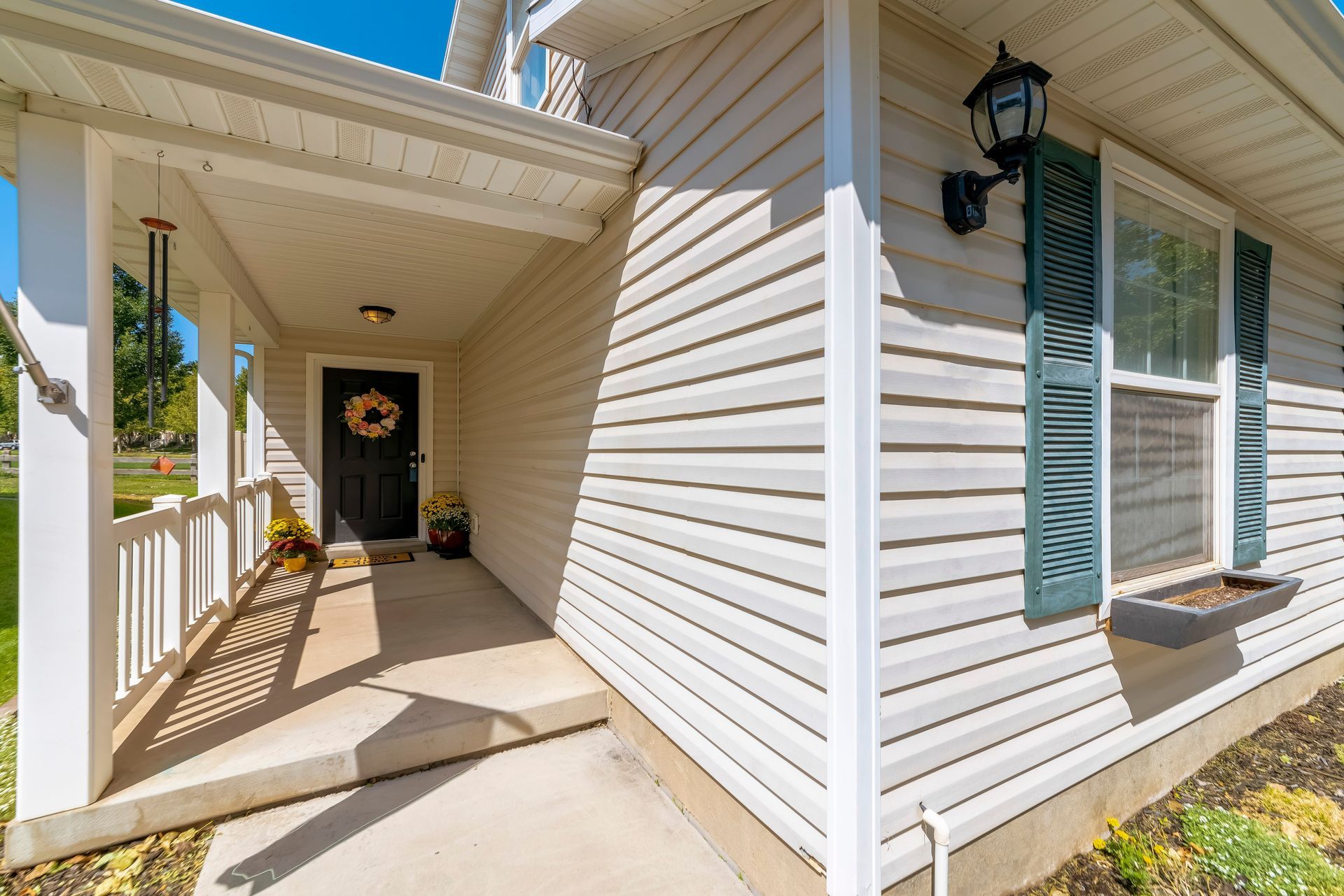 Beige house exterior with porch