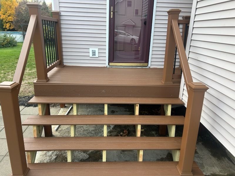 A wooden fence with a gate attached to it.