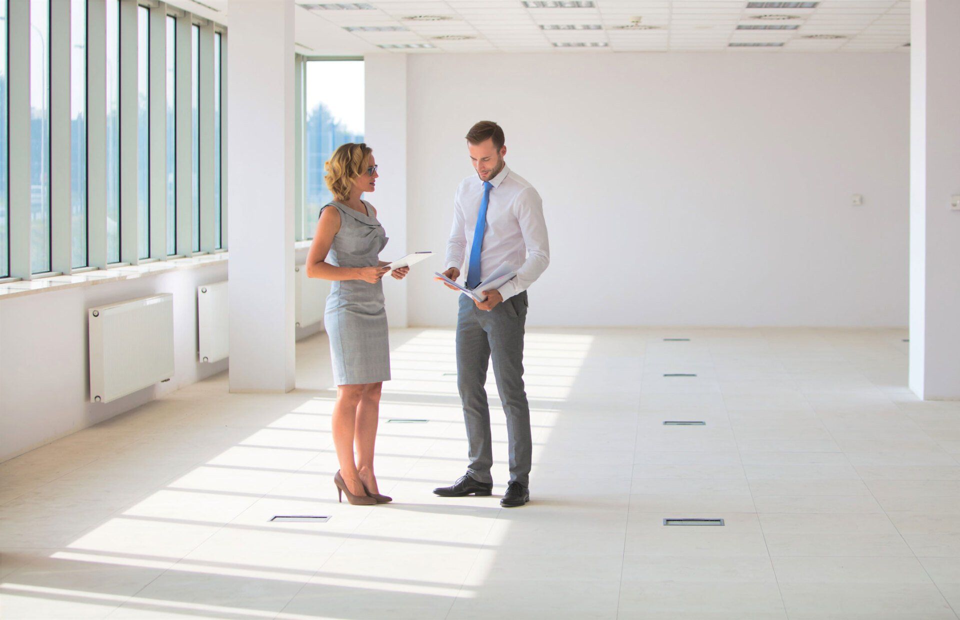 Businessman And Businesswoman Discussing | Sarasota, FL | Mapp Realty & Investment Co