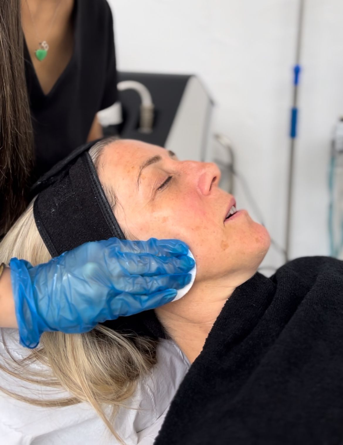 Client receiving AlumierMD TXA Peel treatment at Sutha Aesthetics Hitchin