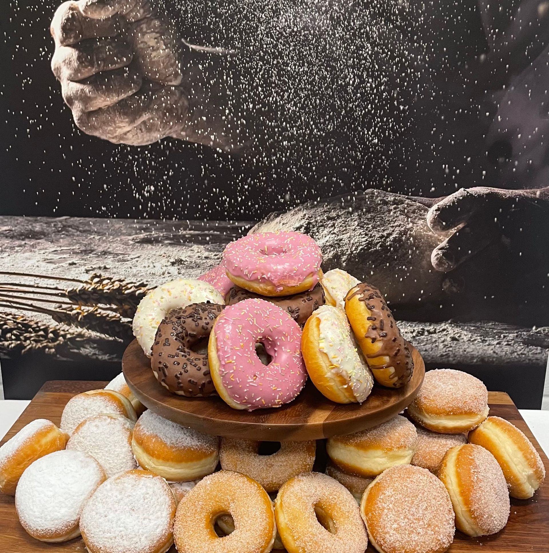 A bunch of donuts are stacked on top of each other
