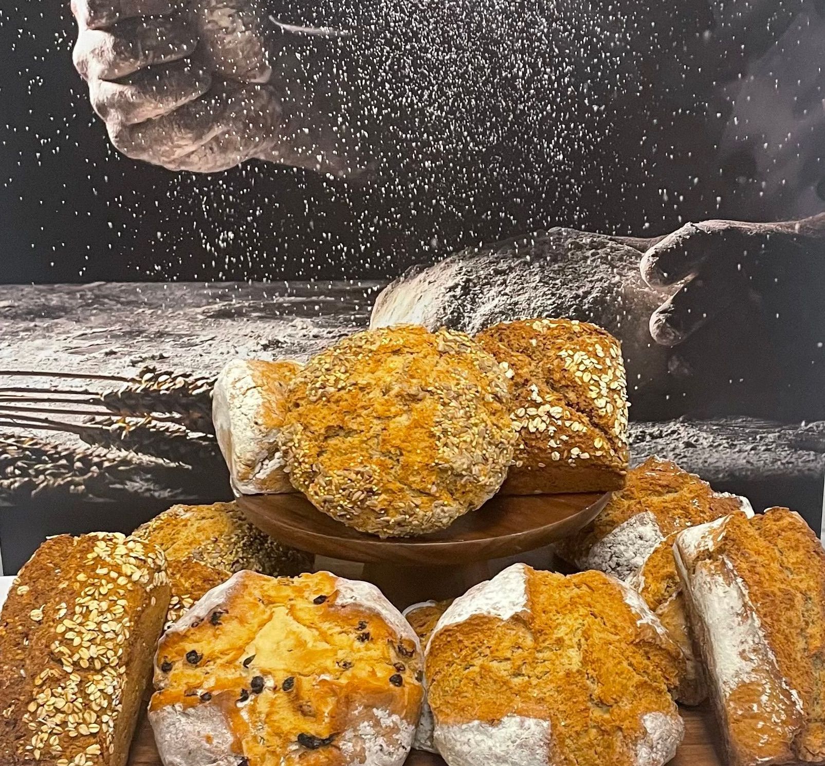 A bunch of bread sitting on top of a wooden table