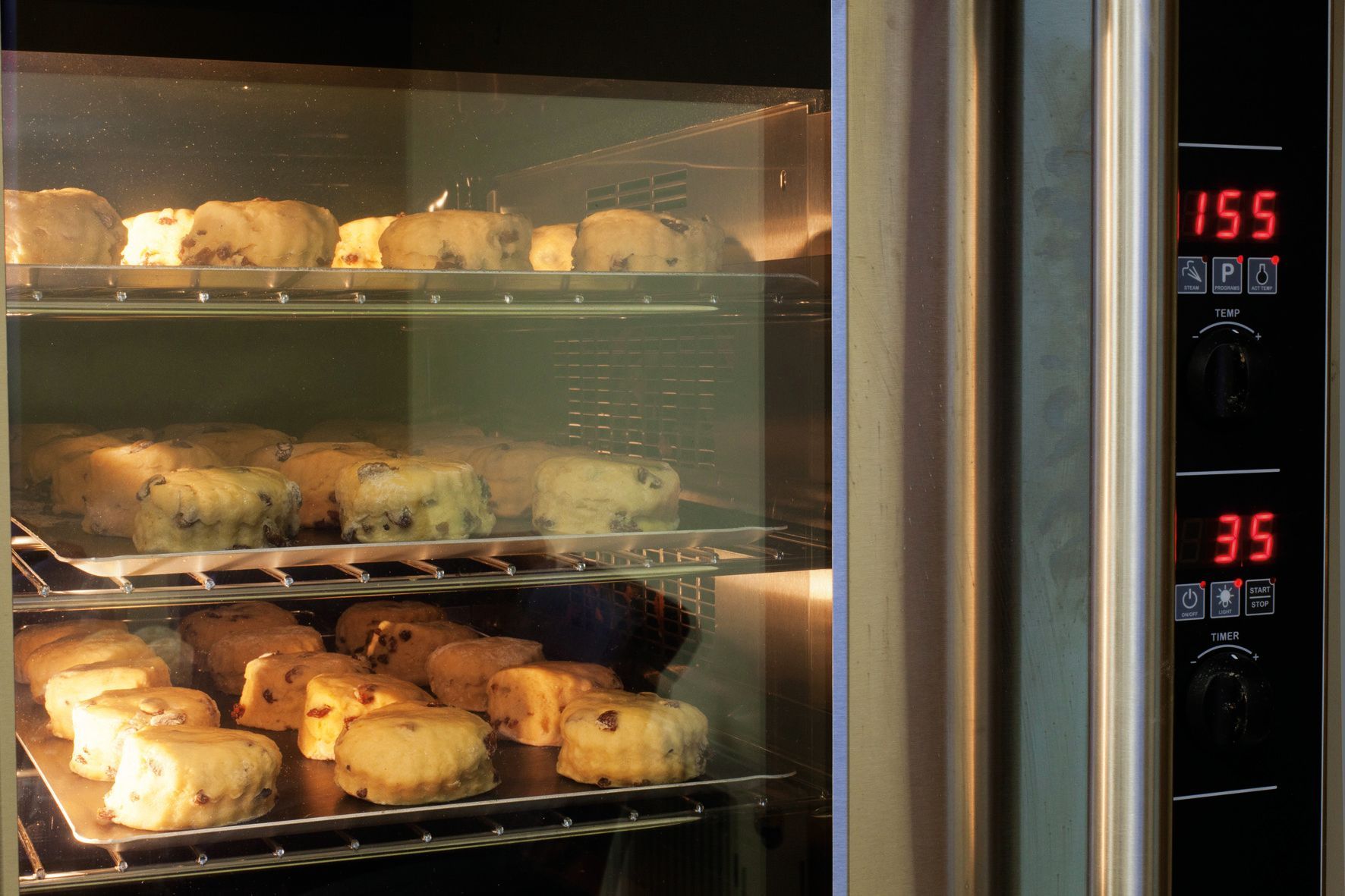 A digital oven displays the temperature as 35 degrees