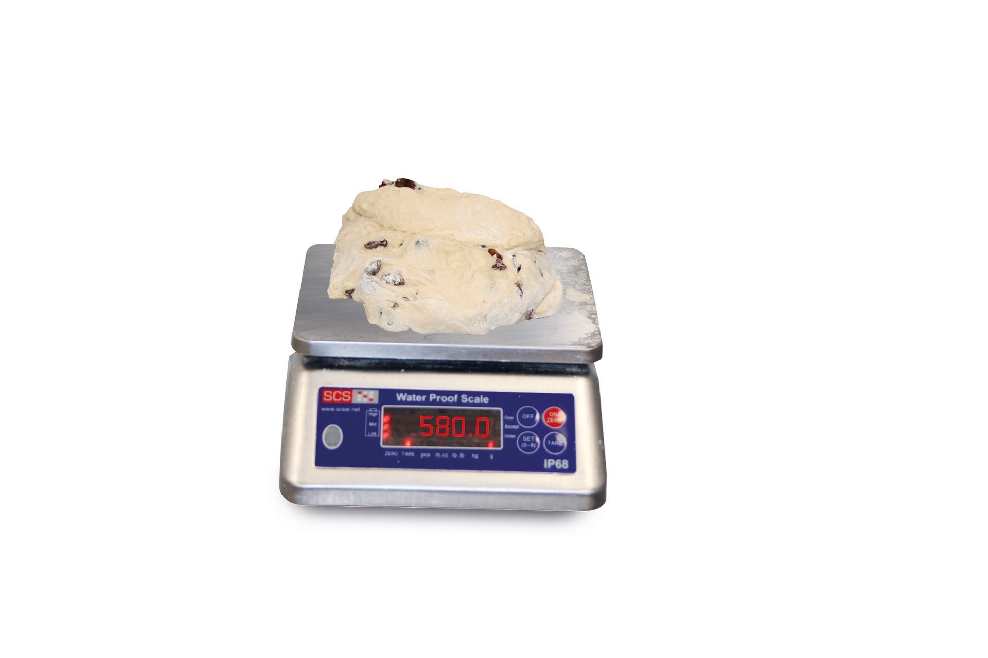 A piece of dough is sitting on top of a digital scale.
