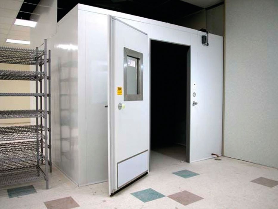 A white room with a sliding door and a window